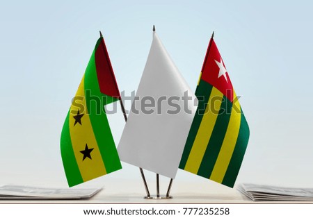 Flags of Sao Tome and Principe and Togo with a white flag in the middle