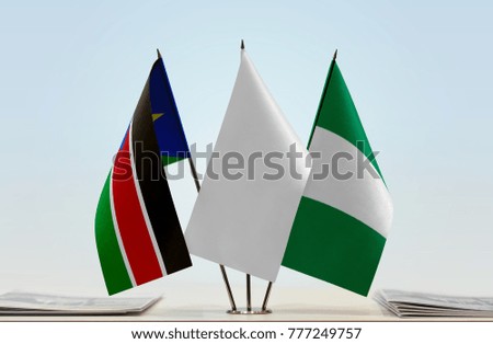 Flags of South Sudan and Nigeria with a white flag in the middle
