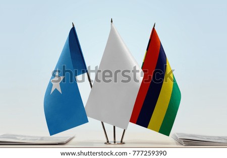 Flags of Somalia and Mauritius with a white flag in the middle
