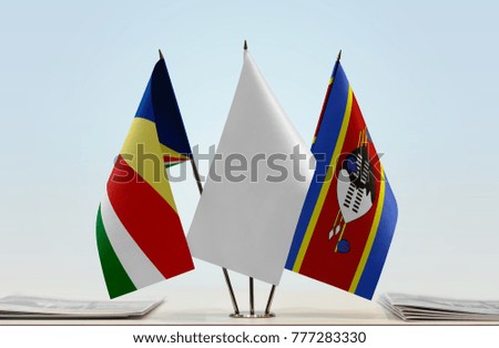 Flags of Seychelles and Swaziland with a white flag in the middle