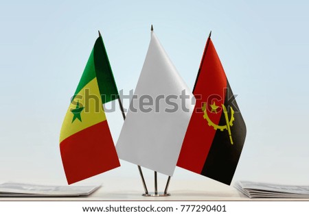 Flags of Senegal and Angola with a white flag in the middle