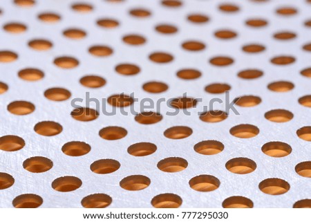 Abstract background of metal surface with holes