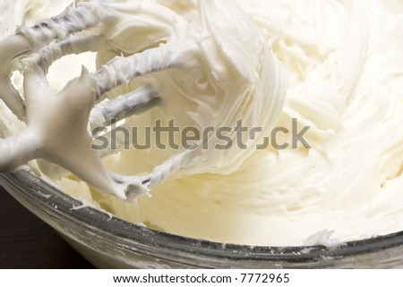 close up of cream cheese frosting mixed up in a glass bowl Royalty-Free Stock Photo #7772965