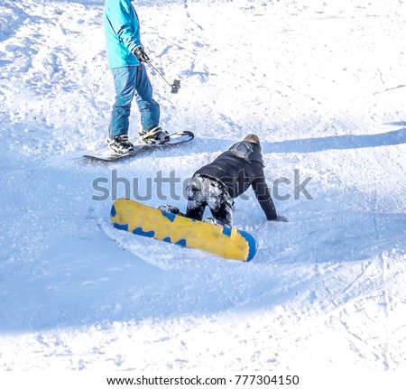 Falling skier on the mountainside at the ski resort