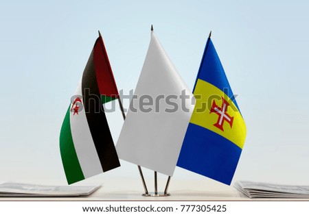 Flags of Sahrawi Arab Democratic Republic and Madeira with a white flag in the middle
