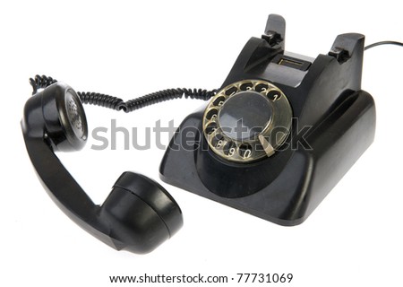 Vintage black telephone with numbers isolated over white