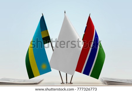 Flags of Rwanda and The Gambia with a white flag in the middle