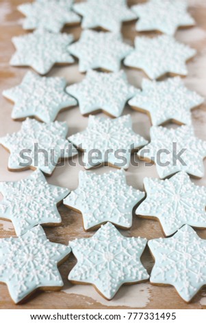Gingerbread star cookie for Christmas on white background. Top view, selective focus.