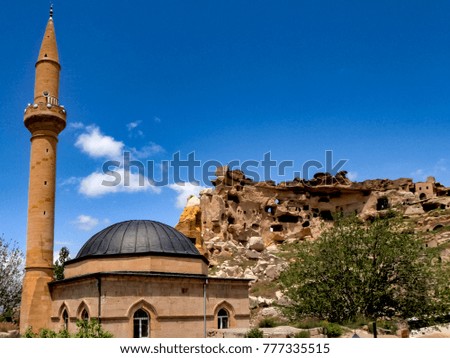 Mosque and ancient cave town in Cavusin Village, Cappadocia.