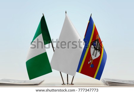 Flags of Nigeria and Swaziland with a white flag in the middle