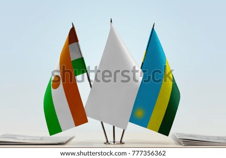 Flags of Niger and Rwanda with a white flag in the middle