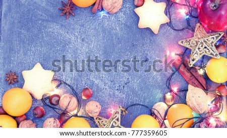 Background of Christmas decorations and gifts with multi-colored garlands. 