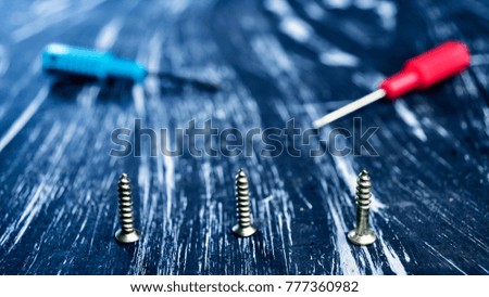 Screwdrivers to repair lying on the table. 
