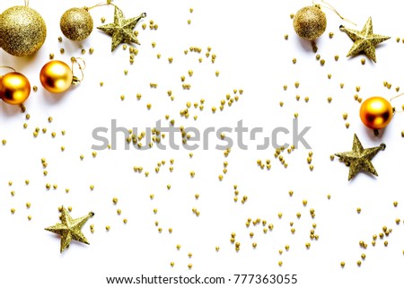 Beautiful golden Christmas toys and decorations patterns and mockups on the white background flat lay