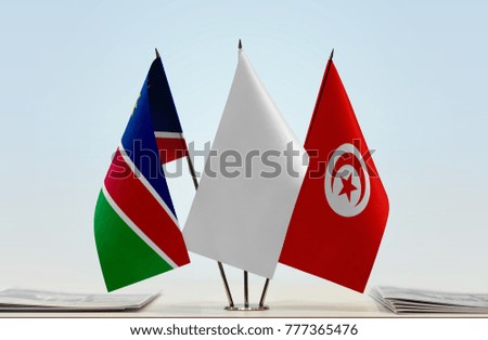 Flags of Namibia and Tunisia with a white flag in the middle