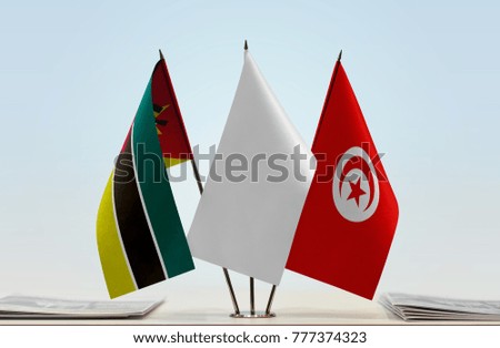Flags of Mozambique and Tunisia with a white flag in the middle