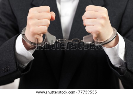 Police steel handcuffs arrests business men hands Royalty-Free Stock Photo #77739535