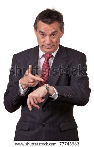 Attractive Middle Age Business Man in Suit Pointing at Watch