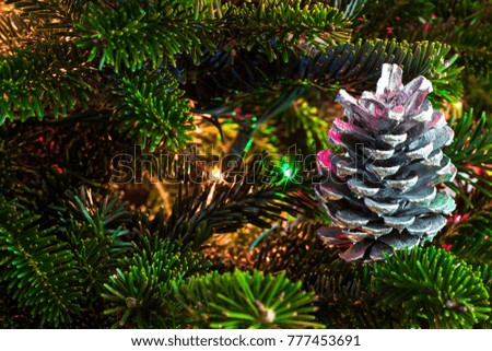 Silver pine cone on a Christmas tree