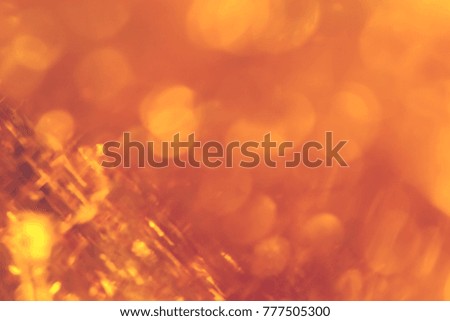 Abstract xmas Gold sparkles or glitter lights. Christmas festive gold background. Defocused lines bokeh or particles. Template for design