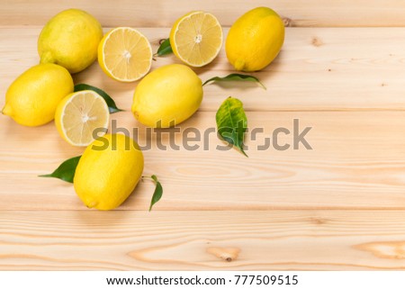 in the corner of wooden boards yellow citrus fruits, place for inscription