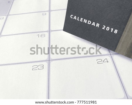 Top view on working memo paper calendar plate with desktop 2018 calendar