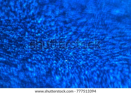 Abstract xmas Blue glitter lights. Christmas festive  background. Defocused bokeh  particles. Template for design