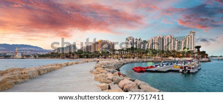 Panoramic view on the central public pier and beach in Eilat - famous resort city in Israel Royalty-Free Stock Photo #777517411