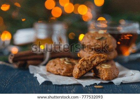 Christmas Cookies on Wooden background with Christmas Holly