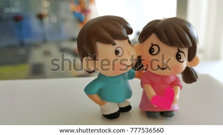 Couple dolls stand together with romance.