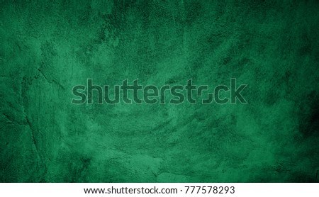 Beautiful Abstract Grunge Decorative Green Dark Stucco Wall Background. Art Rough Stylized Christmas Texture Banner With Space For Text. Textured background with bright center spotlight