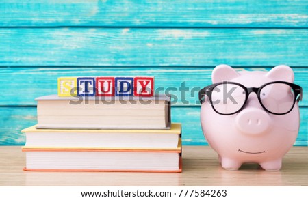Books stack and school supplies on wooden table