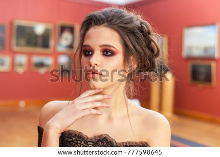 beautiful young woman in the picture gallery