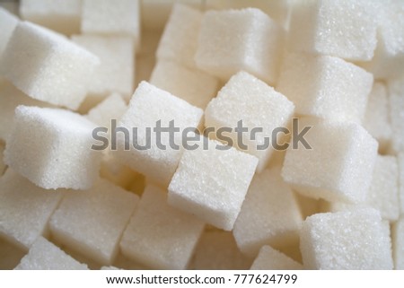 Close up shot of white refinery sugar. Royalty-Free Stock Photo #777624799