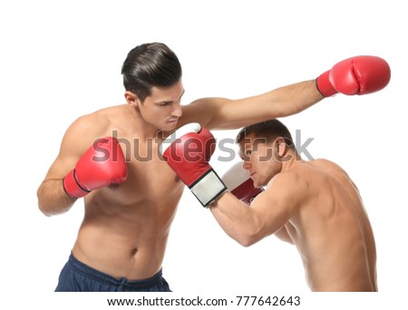 Attractive young boxers fighting on white background