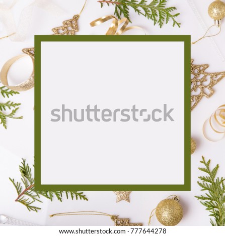 Christmas holiday composition, blank advertising. Festive creative golden pattern, xmas gold decor holiday ball with ribbon, gift, snowflakes, christmas tree on white background. Flat lay, top view