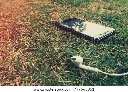smart phone on green grass
