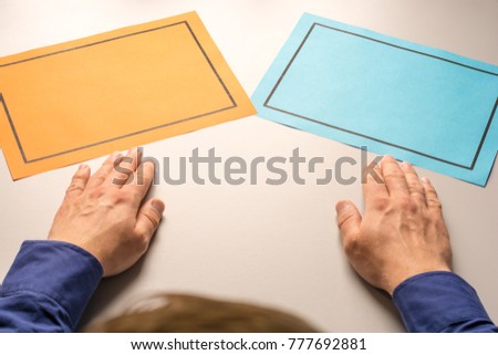 Two blank papers on a desk as a symbol of making decisions as a template