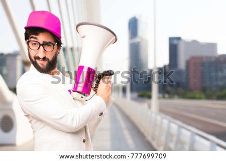 young crazy businessman with a megaphone