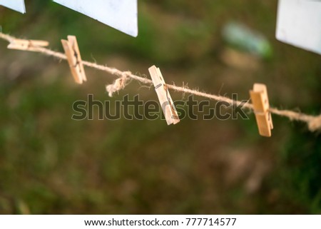 Set of Brown Wooden Clothespins on rope