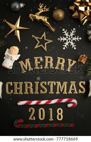 Christmas holiday background with gold ornaments and decorations. Merry christmas and happy new year greeting card with copy space. Christmas celebration holiday background.