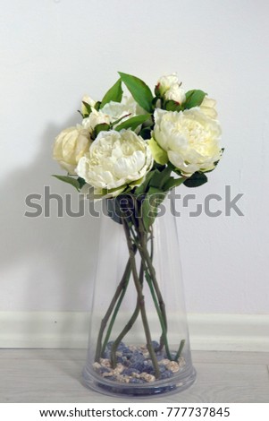 White flowers in my laugh . Beautiful flowers bouquet: roses in flowerpot . White roses in a glass rosette