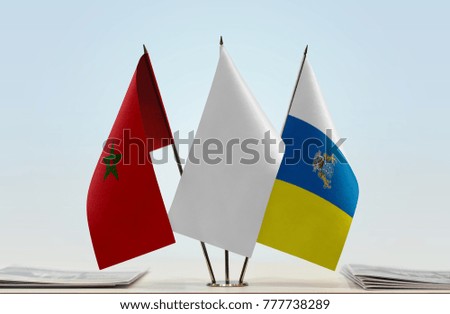 Flags of Morocco and Canary Islands with a white flag in the middle