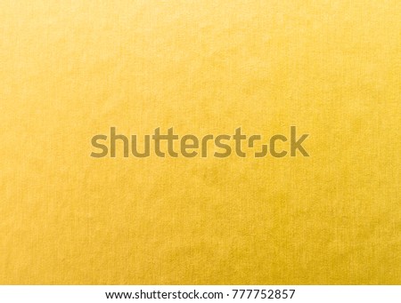 Gold foil leaf metallic wrapping paper shiny texture background for Christmas and holiday wall paper decoration element