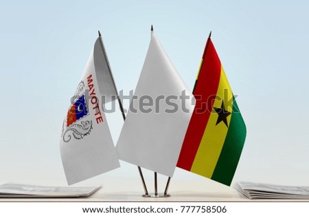 Flags of Mayotte and Ghana with a white flag in the middle