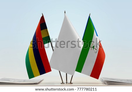 Flags of Mauritius and Equatorial Guinea with a white flag in the middle