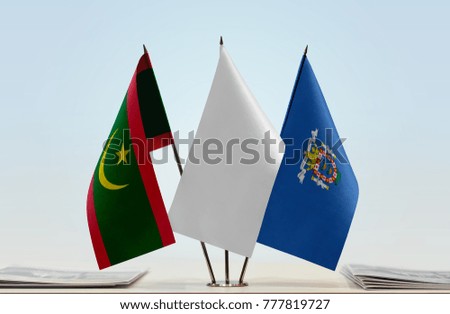 Flags of Mauritania and Melilla with a white flag in the middle