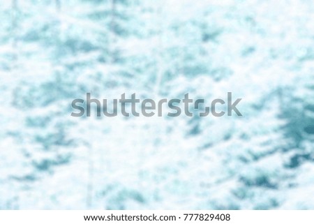 BLUR OF FOREST IN SNOW, WINTER BACKGROUND
