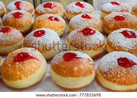 classic Hanukkah sufganiyot filled with strawberry jelly