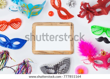 Carnival or mardi gras masks on white background for banner design. View from above. Flat lay